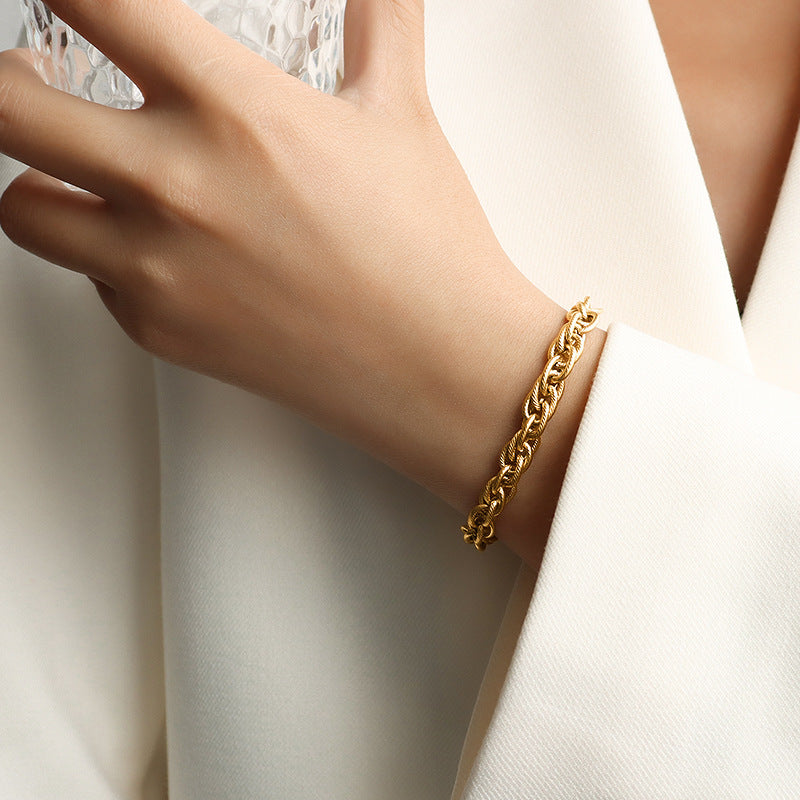 Armband „Niora“ – Gliederarmband aus Titanstahl, vergoldet